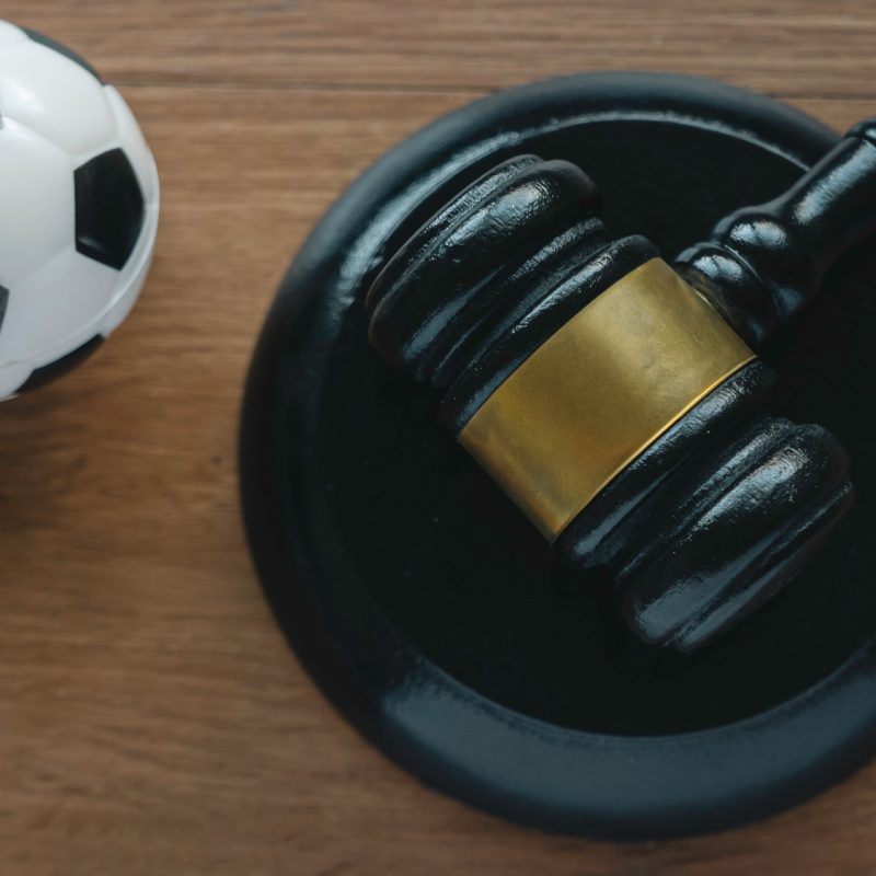 Law and soccer sport.Football coach accused. Concussion lawsuit.